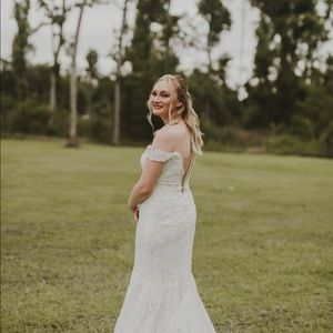Plunging off shoulder wedding dress